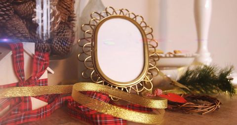 Festive Holiday Decorations with Gold Frame and Gift Boxes