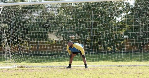 African American Male Goalkeeper Focused in Soccer Match