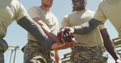 Diverse Soldiers Celebrating Camaraderie Outdoors