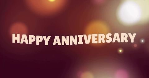 Happy Anniversary Greeting Text with Warm Bokeh Lights and Festive Retro Typography