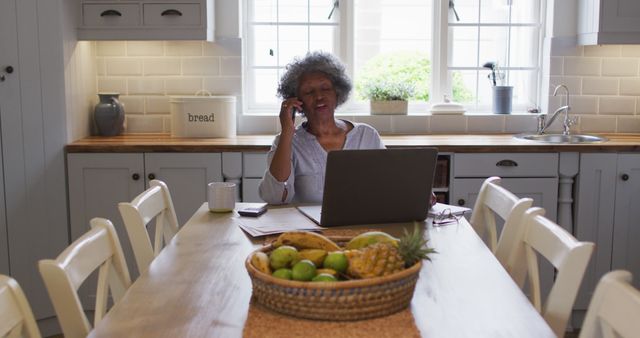 Senior Woman Working from Home on Laptop in Modern Kitchen - Download Free Stock Images Pikwizard.com