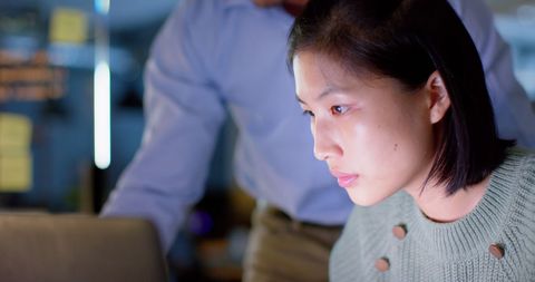 Focused businesswoman working late on laptop in office