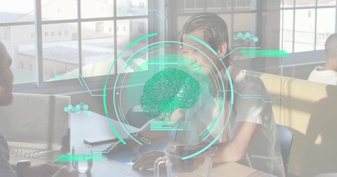 Smiling Asian woman leaning and collaborating in sunlit coworking space with brain HUD overlay