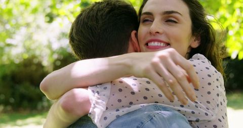Joyful Embrace in Sunlit Park - Download Free Stock Images Pikwizard.com