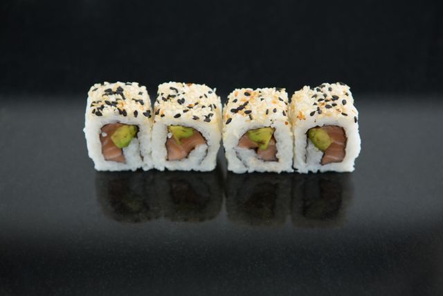 Close-Up of Fresh Sushi Rolls with Black Background - Download Free Stock Photos Pikwizard.com