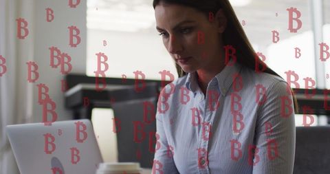 Businesswoman using laptop clouded by bitcoin symbols