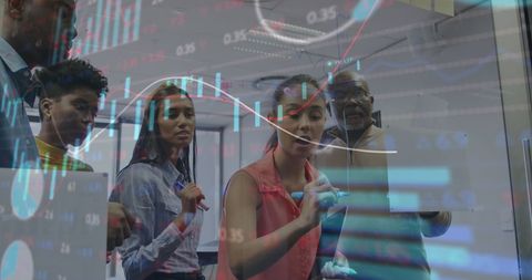 Diverse business team analyzing financial graphs and data projections