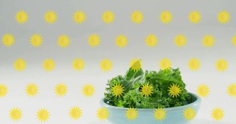 Kale in light blue ceramic bowl with yellow sunburst overlay minimal flatlay for wellness
