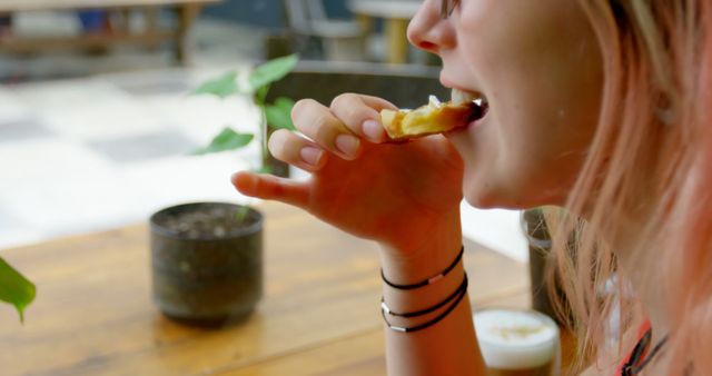 Woman Enjoying Pastry in Outdoor Café Setting - Download Free Stock Images Pikwizard.com