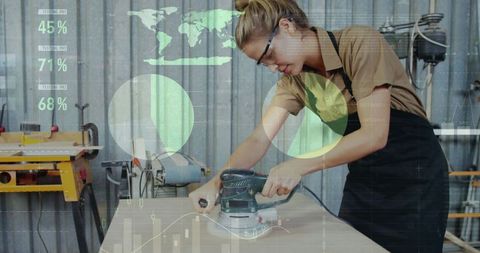 Female carpenter working with futuristic data projection in workshop