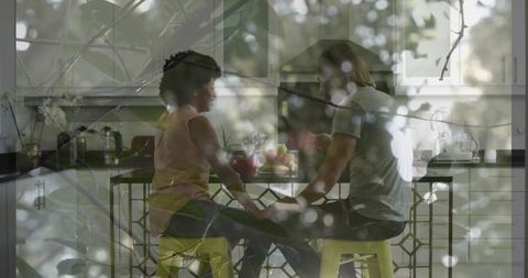 Couple Holding Hands at Modern Kitchen Island in Cozy Surroundings