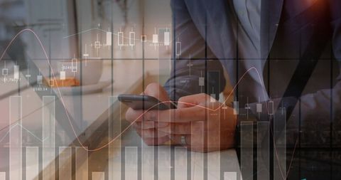 Businessman Using Smartphone with Data and Graph Overlay Concept