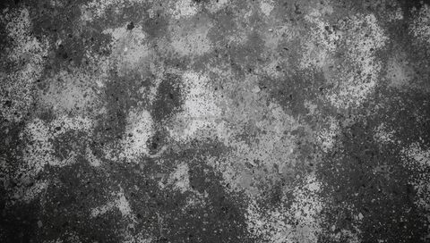 Weathered concrete revealing peeling paint and mottled patina grunge texture background