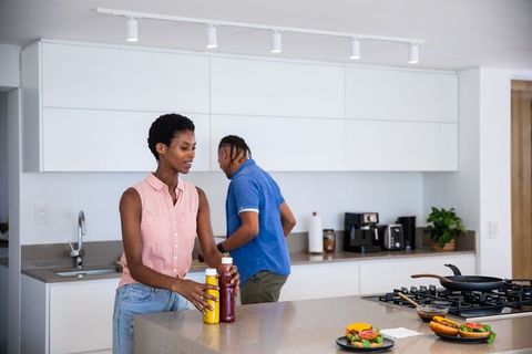 Diverse Couple Preparing Food in Modern Kitchen