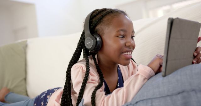 Young Girl Relaxing with Tablet and Headphones at Home - Download Free Stock Images Pikwizard.com