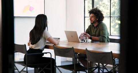 Diverse colleagues collaborating in office meeting room