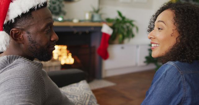 Smiling Couple Enjoying Cozy Christmas Evening by Fireplace - Download Free Stock Images Pikwizard.com