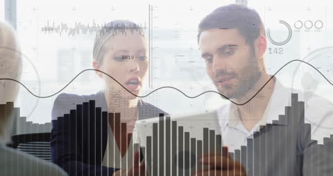 Business Professionals Analyzing Dynamic Financial Data on Tablet