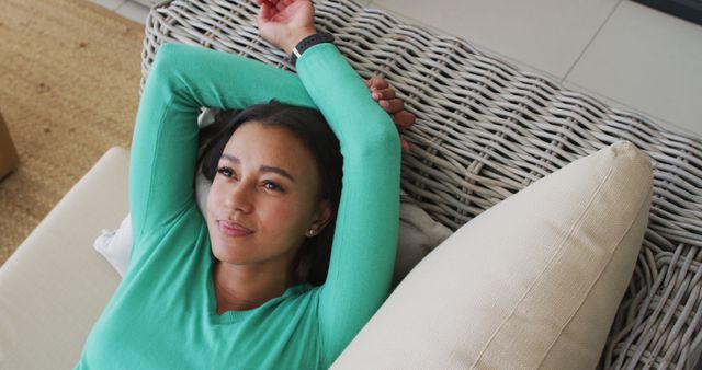 Young Woman Relaxing on Comfortable Couch in Casual Home Setting - Download Free Stock Images Pikwizard.com