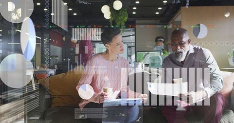 Diverse Team Analyzing Financial Data in Modern Office Corporate Setting