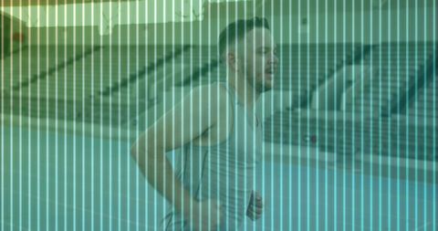 Midadult runner sprinting on track past stadium bleachers with teal stripe overlay