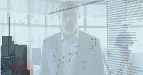 Businessman Analyzing Financial Graphs and Data in Modern Office