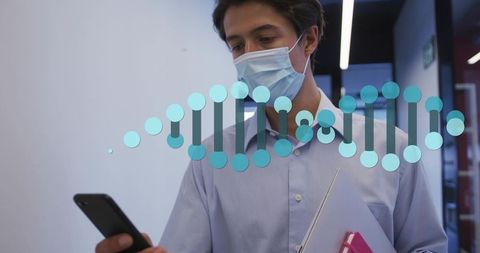 Young professional wearing surgical mask holding phone and tablet with dna helix overlay