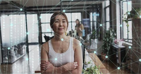 Asian Businesswoman with Digital Network Overlay in Modern Office