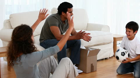 Family Bonding Playing with Soccer Ball at Home