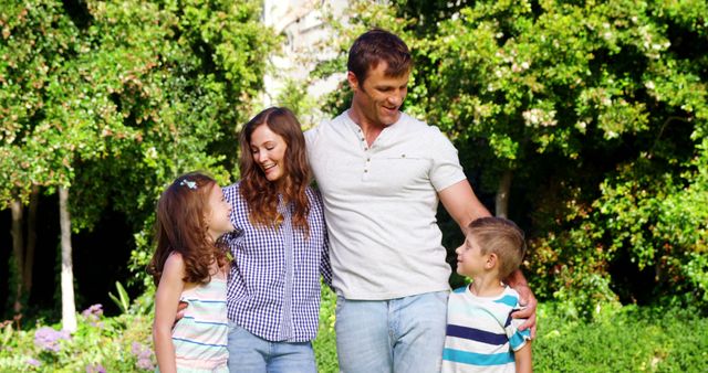 Family enjoying quality time outdoors in vibrant green park. Perfect for themes like family bonding, outdoor activities, parenting, nature outings, lifestyle. Suitable for advertisements, blogs about family life, brochures on parks or community services.
