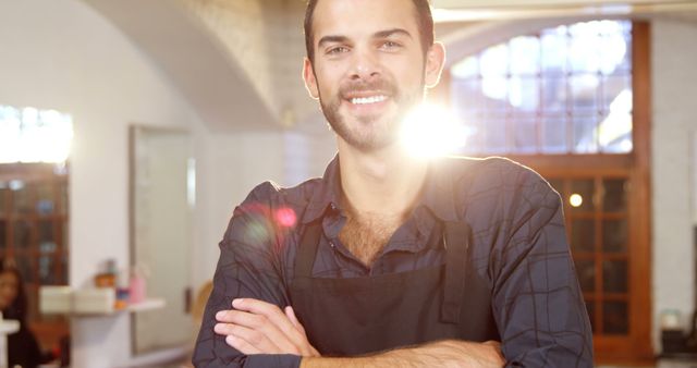 Smiling Barber in Black Apron Standing in Bright Hair Salon - Download Free Stock Images Pikwizard.com