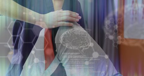 Therapist treating leg injury with medical data overlay