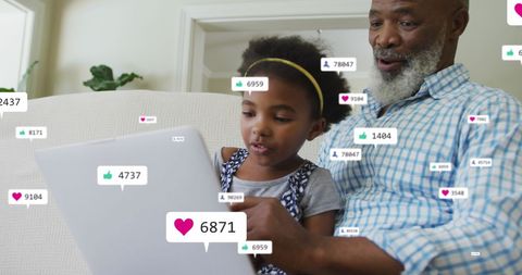 Grandfather and Granddaughter Engaging with Social Media
