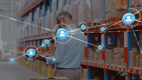Logistics Manager Analyzing Network Connections in Warehouse