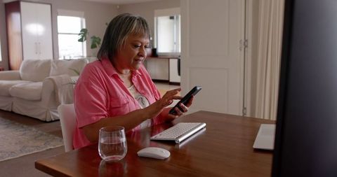 Mature Woman Engaged in Remote Work from Home Office