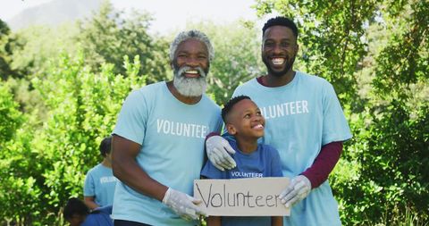 Happy Multigenerational Family Volunteering Together Outdoors