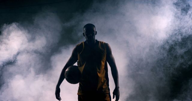 Silhouette of basketball player standing in mist - Download Free Stock Images Pikwizard.com