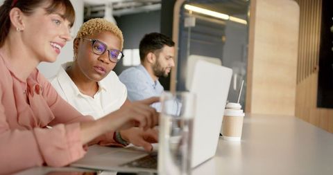 Diverse Team Discussing Project Ideas at Modern Office Table