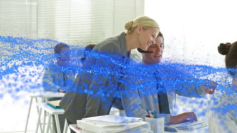 Team Collaborating in Modern Digital Office with Blue Graphics