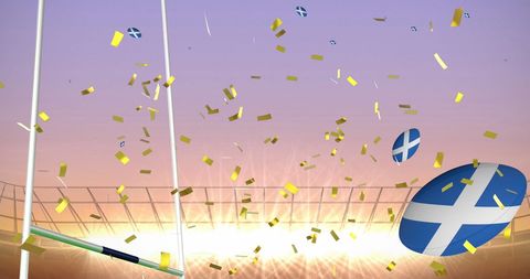 Rugby Balls with Scotland Flags Amidst Golden Confetti at Stadium