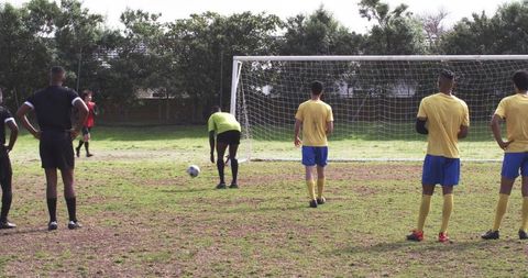 Soccer player preparing penalty kick on classic outdoor field
