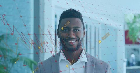 Smiling businessman standing amid augmented reality data mesh in modern office breakroom