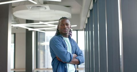 Confident Entrepreneur Standing in Modern Office with Arms Crossed - Download Free Stock Images Pikwizard.com