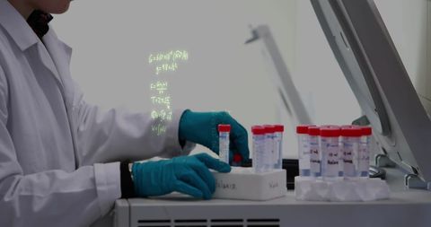 Scientist Analyzing Specimens with Mathematical Equations Projection
