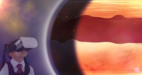 Child exploring virtual planet with vr headset