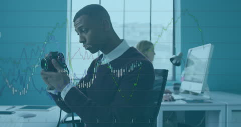 Businessman Analyzing Financial Markets Using Camera