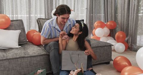 Romantic Multiracial Couple Celebrating Birthday with Gifts