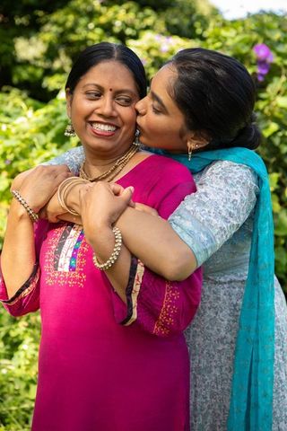 Joyful Moment Between Mother and Daughter in Garden