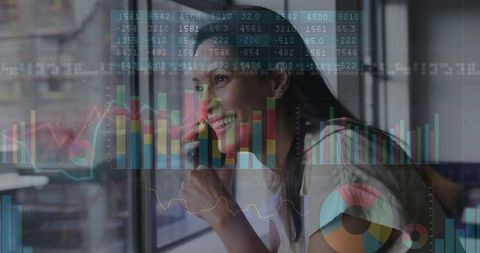 Confident Businesswoman Analyzing Financial Charts by Window