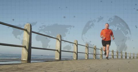 Senior runner jogging on coastal promenade with dotted globe overlay for healthy lifestyle